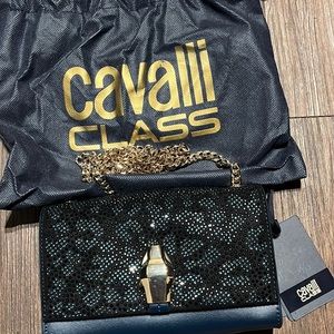 Blue and black with a animal pattern design with crystal like studs on it